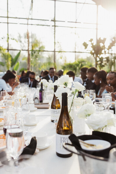 Close-up shot of a long table for the guests of the wedding at the reception area.