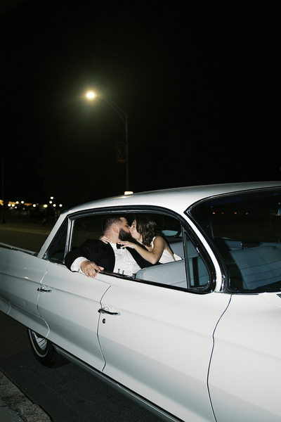 First drive home as a married couple in a vintage white car | Megan Smith Photo
