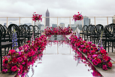 Close-up of pastel floral arrangement on table, gold cutlery.