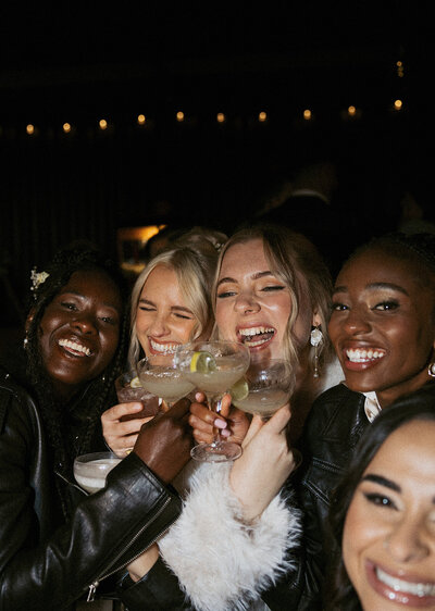 bridal party sharing drinks at wedding