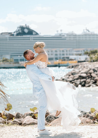 A bride and groom at their cruise ship wedding in the Bahamas with a destination wedding photographer