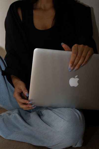 Close-up of a client at home on a laptop for a first online therapy session with Jessie Withers, trauma therapist in Los Angeles and Pasadena.