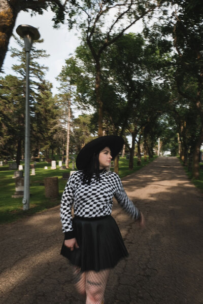 Wacky, wild, & weird copywriter, Dani walks in a graveyard