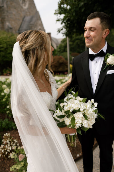 groom hugging bride from behind