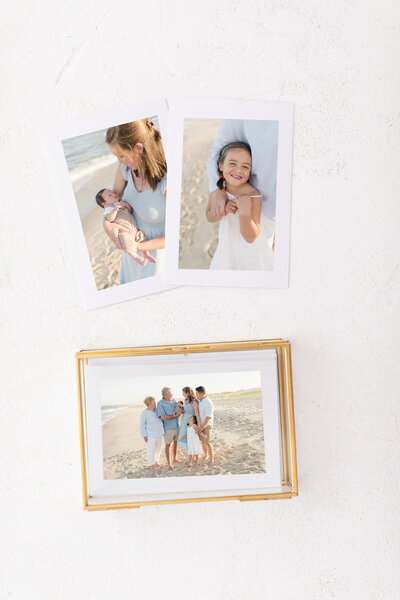 A glass photo box of proof prints for every Courtney Landrum Photography client.