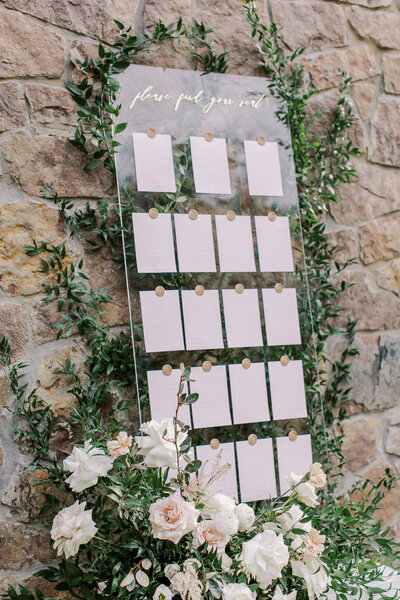 acrylic seating chart with luxury floral display