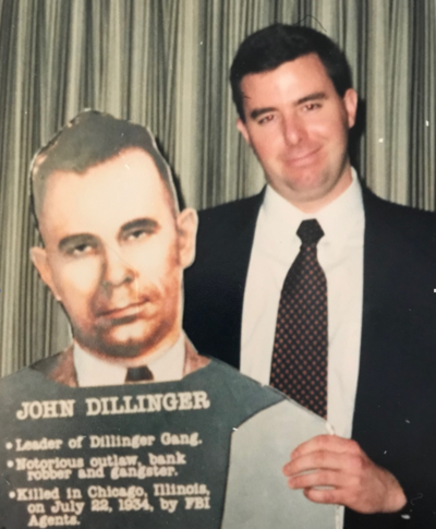 FBI Special Agent William Rose holding with cutout of John Dillinger