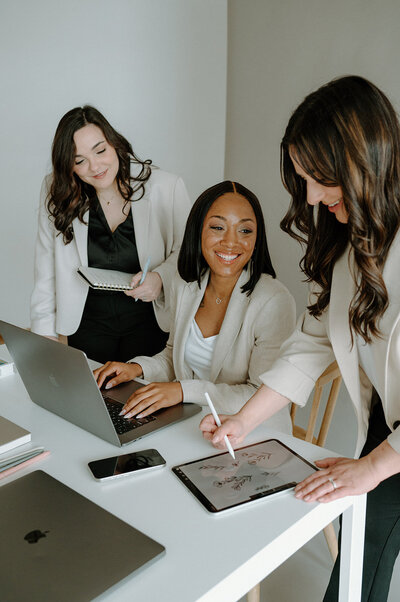 Brand and Showit website designer in Fort Wayne, IN sitting in a chair