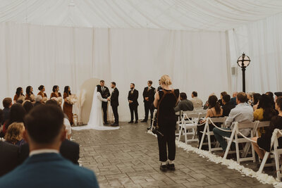 photographer taking pictures of wedding party