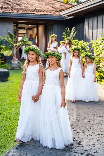Flower girls walking at wedding, taken by big island hawaii wedding photographer