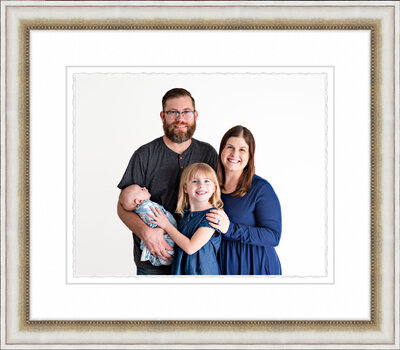 A framed portrait  of a family