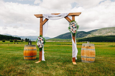 Wedding ceremony wooden arch at P-7 Base Camp in Potomac, MT