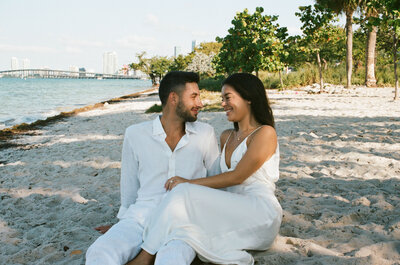 Couple sitting at the beach in Miami, Florida.