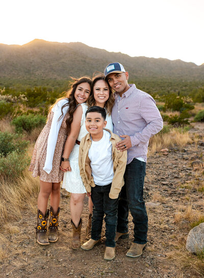 family smiling together in Arizona desert by Cactus & Pine Photography LLC
