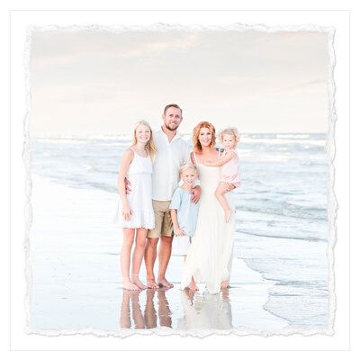 The picture captures a heartwarming family moment on the picturesque Galveston beach at sunset. The family of five - a mom, dad, son, and two daughters - are standing together in the soft, golden light, their faces aglow with joy and contentment.  The scene is set against the stunning backdrop of the vast, shimmering ocean and the gentle waves lapping at the shore. The family is standing in the sand, their toes buried in the warm grains, as they take in the breathtaking view.  The photograph has a clean, pure, and airy style, perfectly capturing the serene and tranquil atmosphere of the moment. The lighting is soft and flattering, casting a warm, golden glow over the family's faces and highlighting their features.  The family's body language and expressions convey a sense of togetherness and happiness. They are standing close to one another, their arms around each other, as if they are sharing a special moment that they will cherish forever.  The overall composition of the image is well-balanced and visually appealing, with the family positioned in the center of the frame and the ocean and sky filling the background. The photographer, Bri Sullivan, has done an excellent job of framing the scene and capturing the essence of the moment.  This photograph is a beautiful and heartwarming representation of a family enjoying a peaceful and joyful moment together on the beach, and it is sure to evoke feelings of warmth and nostalgia in anyone who views it.