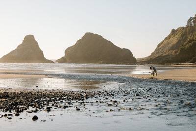 Groom dipping bride on a beach.