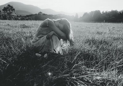 woman taking a moment to take a deep breath