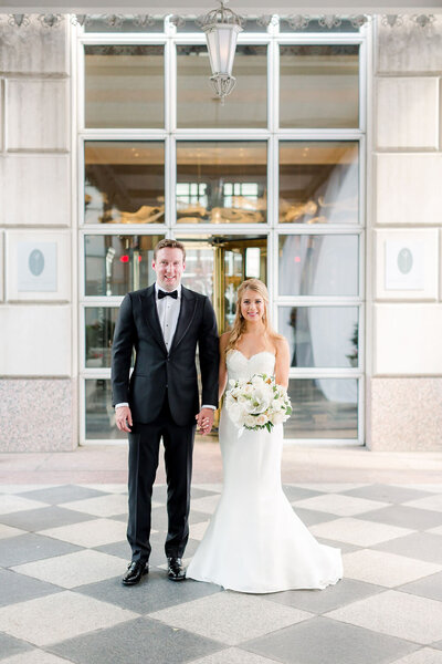 Bride and Groom holding hands and smiling