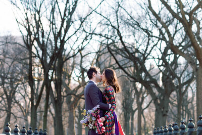 winter central park elopement with rainbow sequin vintage dress at poet's walk