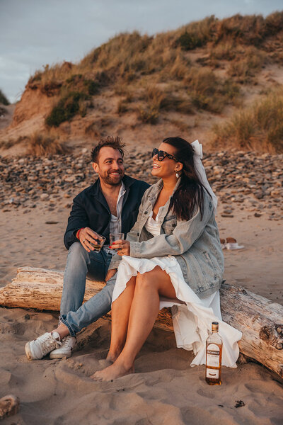 couple sit on beach
