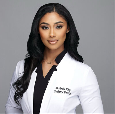 A female dentist posing for a headshot