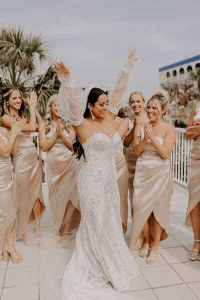 bridesmaids cheer on bride