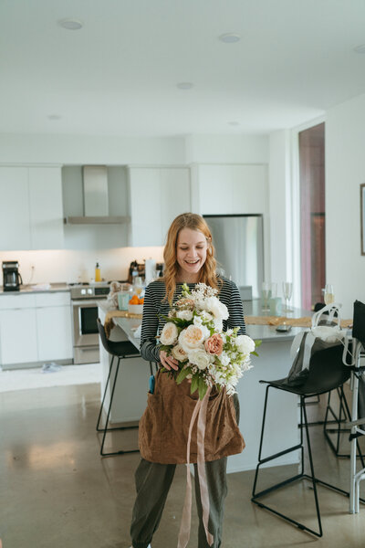 black and white image woman holding flowers