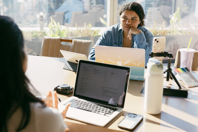 Catryce at Desk with devices