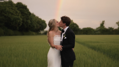 Couple in the field after their wedding