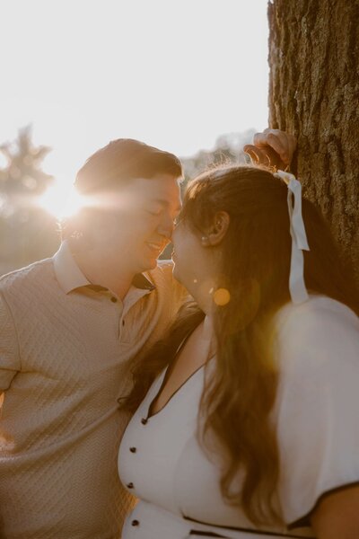 Bride details of ring holding bouquet of baby's breath flowers.