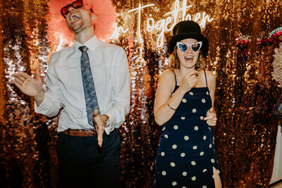 Guest laughing his heart out, during a corporate event, using an AI photo booth with interactive experiences and features