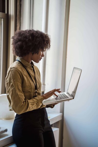 Woman researching on her computer