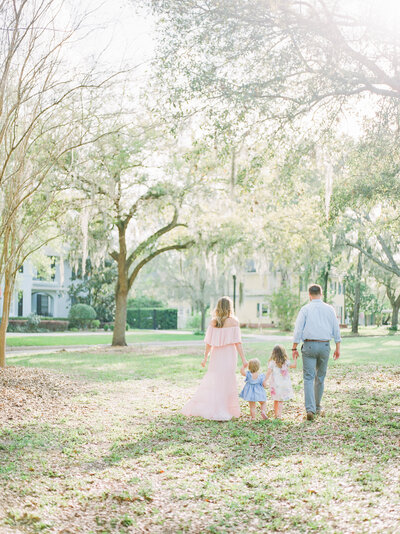family walking together holding hands by Orlando lifestyle photographer