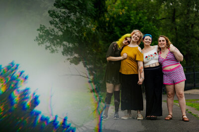 Lesbian Couple piggy back ride during their Engagement Photos with Tiny House Photo