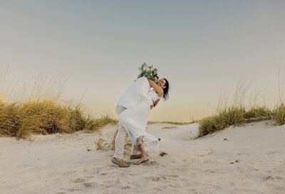 couple dances on beach