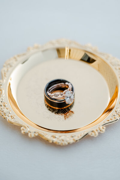 Close-up of wedding rings placed together, symbolizing love and commitment.