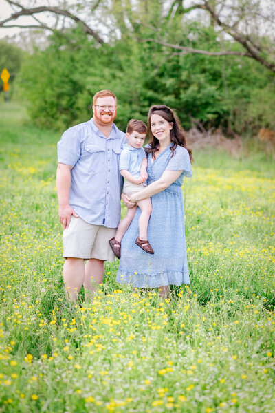 family hand in hand walking for their family session in newnan ga