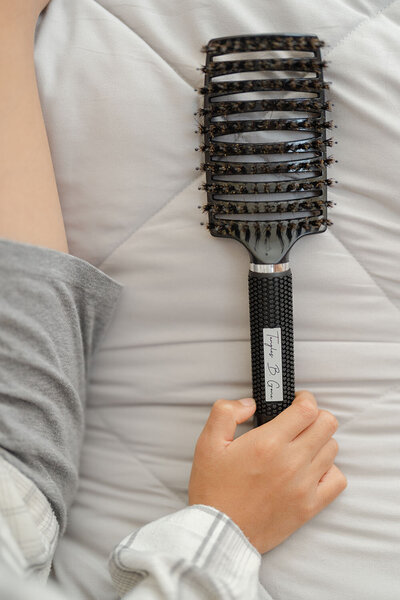 hand holding brush during Gainesville,VA product photo