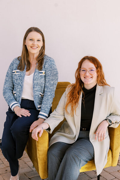 Plan On It ATX wedding planners Shelby and Amy smile at the camera