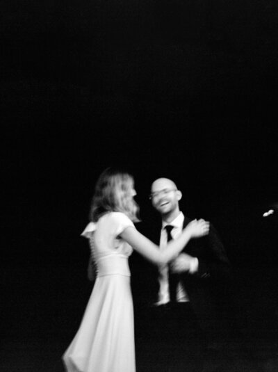 bride and groom first dance laughing