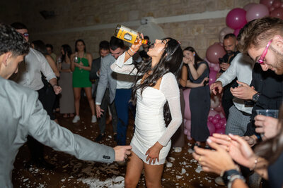 Highlight the engaging interactions and moments of your event with JakeyVass Media's professional photography. This image captures the lively and personal aspects of your occasion. Visit www.jakeyvassmedia.com.au to explore our portfolio and book your event photography session.