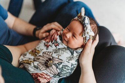newborn-baby-smiling-to-her-parents
