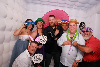 Wedding photo booth image in inflatable enclosure with props