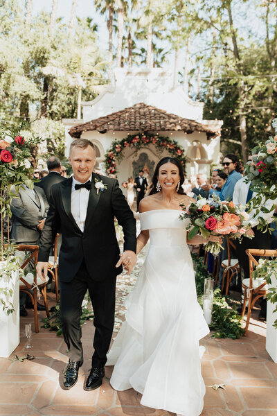 Bride and groom walk up memorial steps at their DC wedding