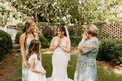 A candid, documentary-style photo of an emotional moment between a bride and her mother at an Atlanta wedding