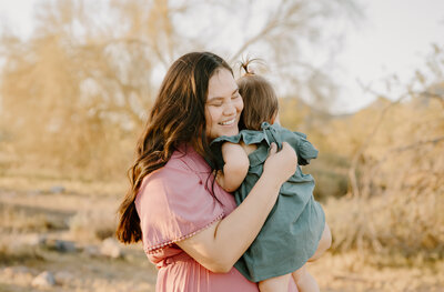 Mom and baby hugging