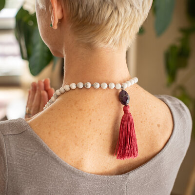 guru beads on woman's back