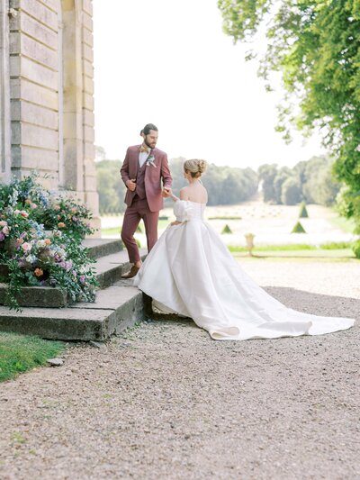Bride and Groom walking up stairs