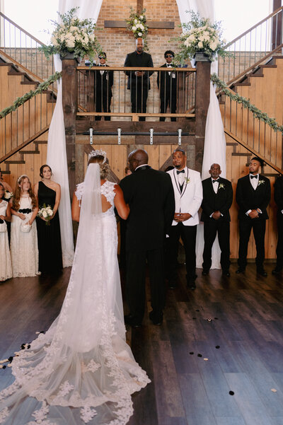A bride and groom have a dance outside of their churh
