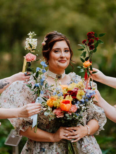 close up of bride with bouquets